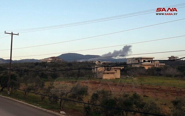 Smoke is seen rising for a site targeted by an alleged Israeli air strike in Masyaf, Syria, March 12, 2023. (SANA)