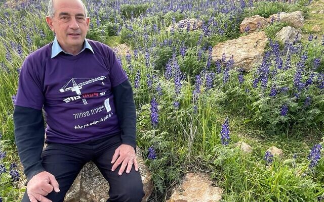 In this undated photograph, Jerusalem Deputy Mayor Yossi Havilio is seen at the Mitzpe-Tel site in southeast Jerusalem during the lupine season. (Courtesy Yossi Havilio)
