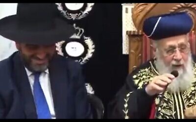 Health and Interior Minister Moshe Arbel (left) smiles as Sephardic Chief Rabbi Yitzhak Yosef tells him he should transfer funds to municipalities on the condition they build synagogues and yeshivas, April 22, 2023. (Twitter video screenshot; used in accordance with Clause 27a of the Copyright Law)