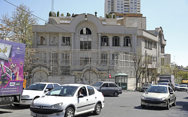 Vehicles drive past the Saudi Arabian embassy in Tehran on April 5, 2023. (ATTA KENARE / AFP)