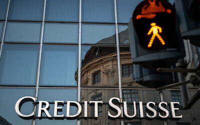 In this file photo taken on April 4, 2023, a sign of Swiss bank Credit Suisse is seen in Basel, on the eve of the general meeting of shareholders following the takeover by UBS of Credit Suisse hastily arranged by the Swiss government on March 19, 2023, to prevent a financial meltdown. (Fabrice COFFRINI/AFP)