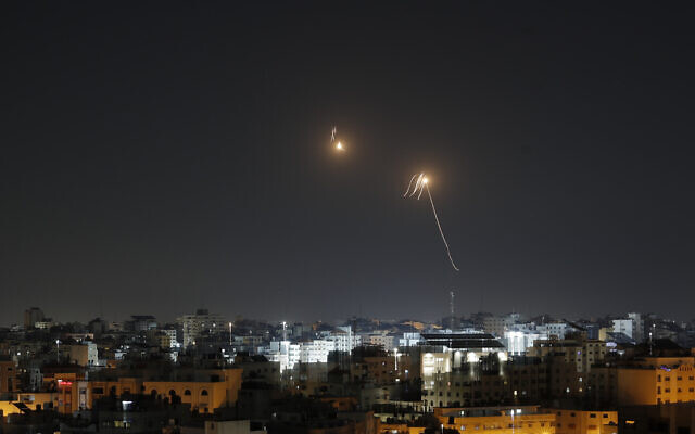 Streaks of light are seen as Israel's Iron Dome air defense system intercepts rockets fired by Palestinian terror groups from the Gaza Strip into Israeli territory on April 7, 2023. (Mohammed Abed/AFP)