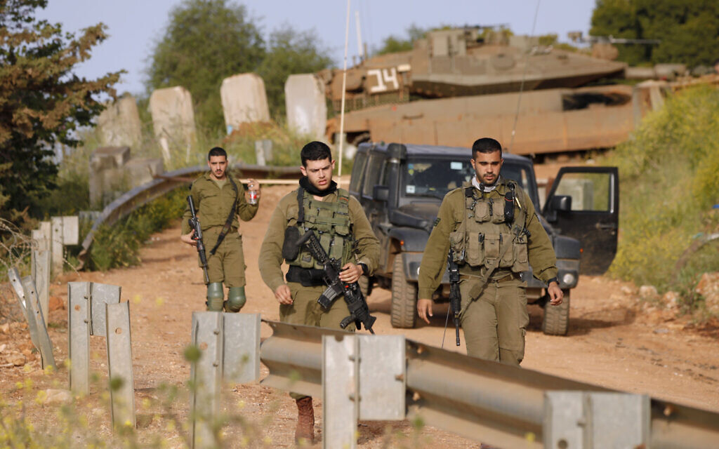 Israeli soldiers patrol near Kibbutz Malkia bordering Lebanon on April 7, 2023. (Jalaa Marey/AFP)