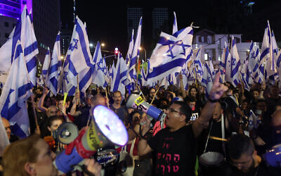 Protesters take part in ongoing demonstrations against the government's judicial overhaul in Tel Aviv on April 8, 2023. (GIL COHEN-MAGEN / AFP)