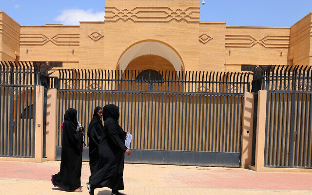 Women walk past the closed Iranian embassy in the diplomatic quarter of the Saudi capital Riyadh, on April 11, 2023. (Fayez Nureldine / AFP)