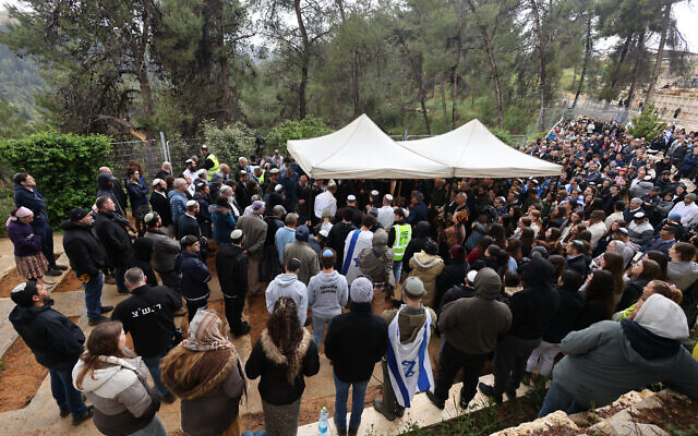 Mourners attend the funeral of Lucy Dee, 48, who was killed in a West Bank terror shooting attack, at the Gush Etzion Regional Cemetery in Kfar Etzion on April 11, 2023. (Menahem KAHANA / AFP)