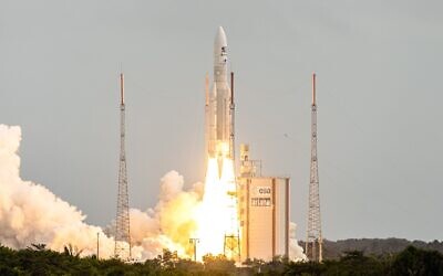 This photograph taken on April 14, 2023, shows Arianespace's Ariane 5 rocket lifting off from its launchpad, at the Guiana Space Center in Kourou, French Guiana. (Jody AMIET / AFP)