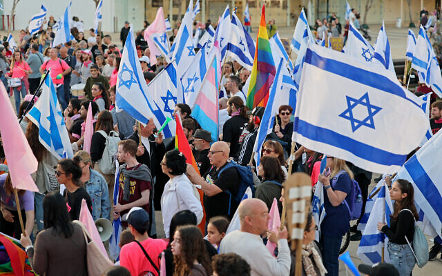 Protesters gather with flags amid ongoing demonstrations against the government's judicial overhaul plans, in Tel Aviv on April 15, 2023. (Jack Guez/AFP)