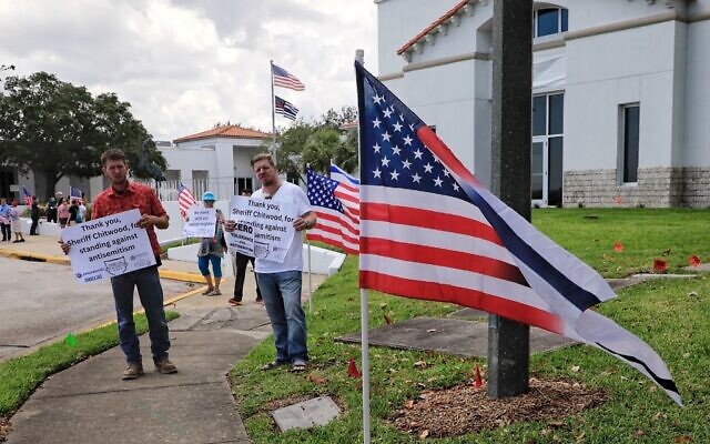 Counter-protesters at a planned neo-Nazi demonstration in Ormond Beach, Florida, thank Volusia County Sheriff Michael Chitwood 'for standing against antisemitism,' April 22, 2023. Chitwood has had white supremacists who have threatened him online arrested and extradited to his county. (Nadia Zomorodian, courtesy of Volusia County Sheriff via JTA)