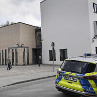 A police car stands in front of the synagogue in Gelsenkirchen, Germany, May 13, 2021. (AP Photo/Martin Meissner)