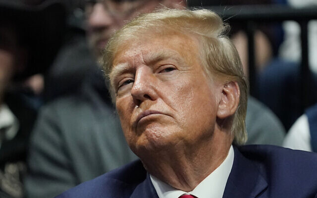 Former US President Donald J. Trump watches the NCAA Wrestling Championships, March 18, 2023, in Tulsa, Oklahoma (AP Photo/Sue Ogrocki)