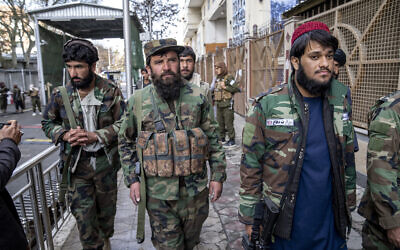 Taliban fighters stand guard at the explosion site, near the Foreign Ministry in Kabul, Afghanistan, Monday, March 27, 2023. (AP Photo/Ebrahim Noroozi)