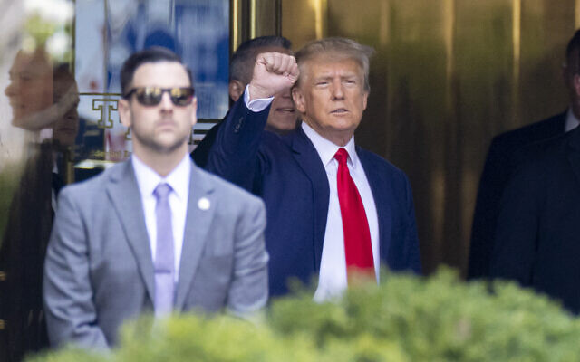 Former president Donald Trump leaves Trump Tower for Manhattan Criminal Court in New York on April 4, 2023. (AP Photo/Corey Sipkin)