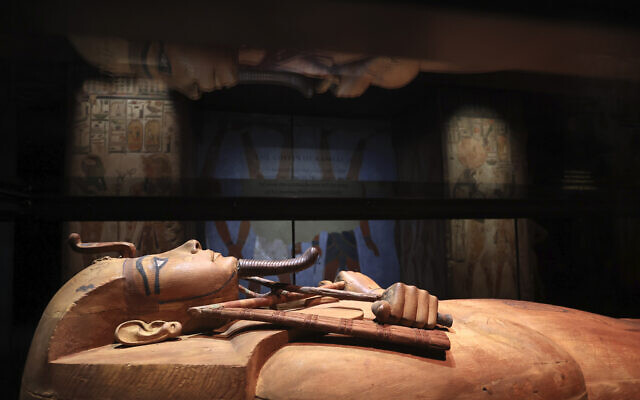 The wooden coffin of Pharaoh Ramses II is on display Thursday, April 6, 2023 in Paris. An exhibition with 181 objects from the Kingdom of Pharaoh Ramses II opens Friday at La Grande Halle de La Villette in Paris.(AP Photo/Aurelien Morissard)