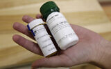 Bottles of abortion pills mifepristone, left, and misoprostol, right, at a clinic in Des Moines, Iowa, September 22, 2010. A federal appeals court has preserved access to an abortion drug for now but under tighter rules that would allow the drug only to be dispensed up to seven weeks, not 10, and not by mail. (AP Photo/Charlie Neibergall, File)