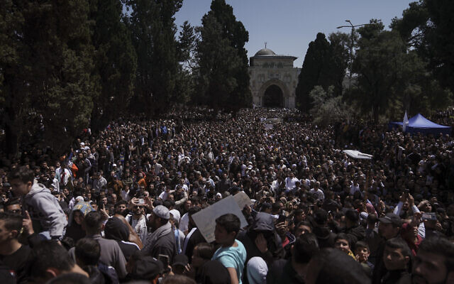 Palestinians gather for a protest against Israel after midday prayers at the Al-Aqsa Mosque compound in the Old City of Jerusalem, during the Muslim holy month of Ramadan, Friday, April 14, 2023. (AP Photo/Mahmoud Illean)