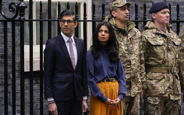 Britain's Prime Minister Rishi Sunak and his wife Akshata Murthy in London, on February 24, 2023. Sunak is under investigation over allegations he failed to disclose shares his wife owns in a child care business that stands to benefit from his government's budget, a parliamentary watchdog disclosed. (AP/ Alberto Pezzali, File)