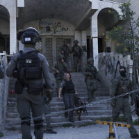 Israeli security forces search for the suspect of a shooting attack in the neighborhood of Sheikh Jarrah in East Jerusalem, April 18, 2023 (AP Photo/Mahmoud Illean)