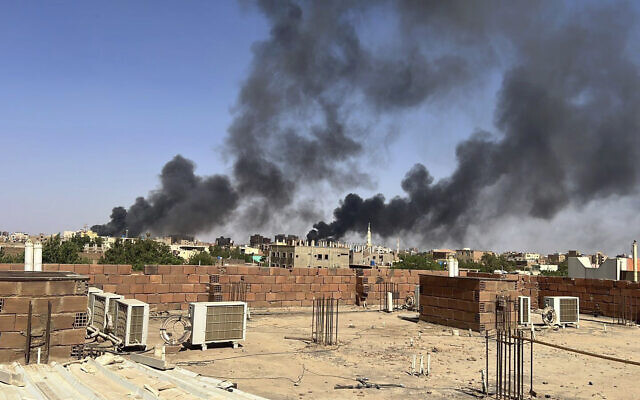 In this photo provided by Maheen S , smoke fills the sky in Khartoum, Sudan, near Doha International Hospital on Friday, April 21, 2023. (Maheen S via AP)