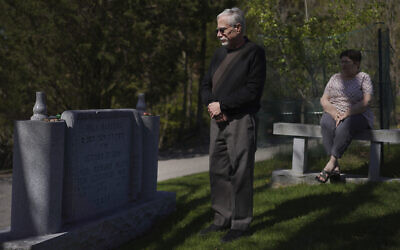 Co-presidents of New Light Congregation, Stephen Cohen and Barbara Caplan, visit a memorial in the New Light Cemetery on Wednesday, April 19, 2023, in Shaler Township, Pennsylvania, honoring the congregants they lost during the Pittsburgh synagogue massacre over four years ago. (AP Photo/Jessie Wardarski)