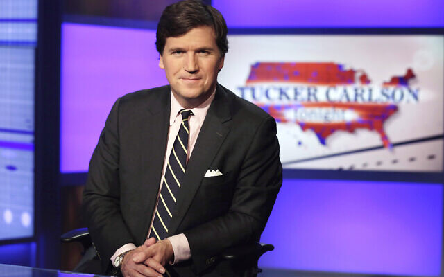 Tucker Carlson, host of 'Tucker Carlson Tonight,' poses for photos in a Fox News Channel studio on March 2, 2017, in New York. (AP Photo/Richard Drew, File)