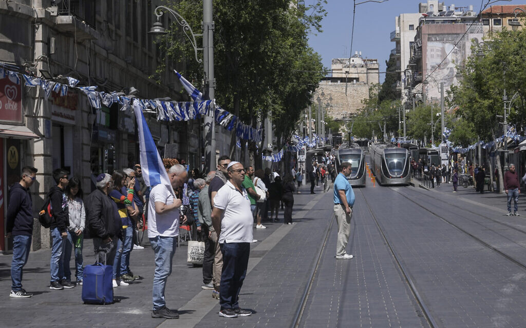 Israelis stand still to observe two minutes of silence as a siren sounds to mark Memorial Day in Jerusalem, April 25, 2023. (AP Photo/Mahmoud Illean)