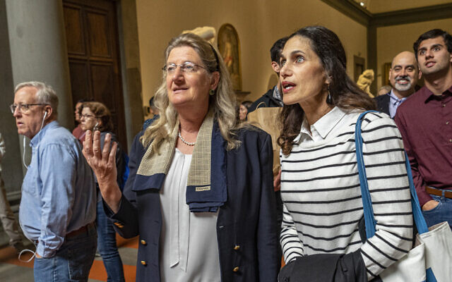 Hope Carrasquilla, the former Dean of the Tallahassee Classical School, Florida (right) with Cecilie Hollberg, director of Florence's Galleria dell'Accademia museum looking at Michelangelo Buonarroti's colossal marble statue "David," in Florence, central Italy, April 28, 2023. (Guido Cozzi/Galleria dell'Accademia di Firenze via AP)
