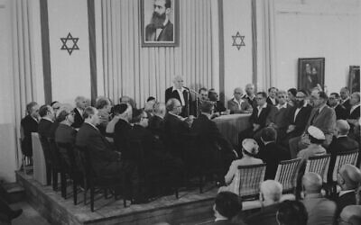 The signers of Israel's Declaration of Independence, at a ceremony at the Tel Aviv Art Museum, May 14, 1948. First prime minister of Israel David Ben Gurion stands up to speak during a session of the new Israeli government. (AP Photo)