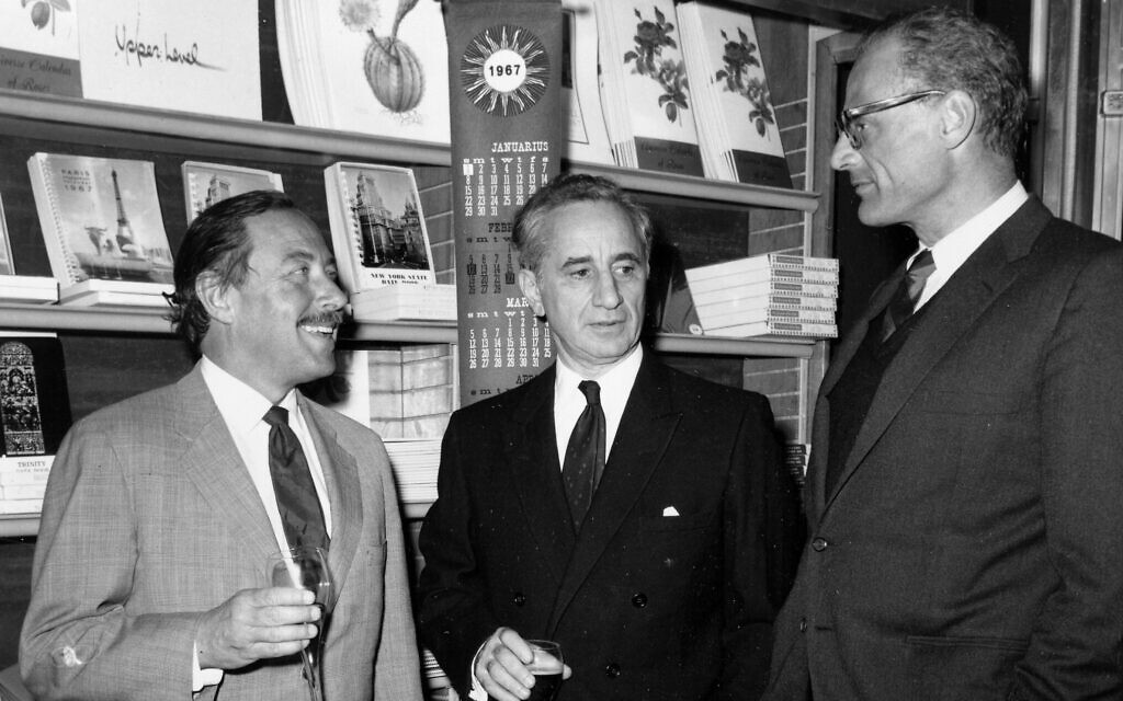 Film director Elia Kazan, center, is flanked by playwrights Tennessee Williams, left, Arthur Miller at Brentano's bookstore in New York City, February 6, 1967.  (AP Photo/J.J. Lent)