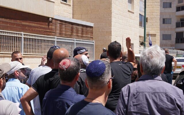 Clashes between security and bereaved family members and friends outside the Beersheba military cemetery on Memorial Day, April 25, 2023. (Emanuel Fabian/Times of Israel)