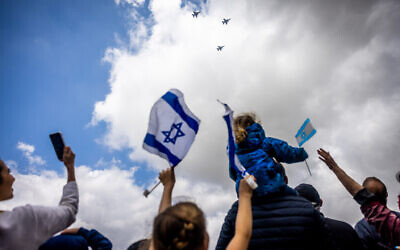 People watch the airshow during Israel's 74th Independence Day celebrations in Jerusalem, May 5, 2022 (Yonatan Sindel/Flash90)