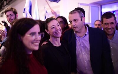 Labor leader Merav Michaeli, center, with Labor party MKs Gilad Kariv, second from right, and Naama Lazimi, left, after the results of the Labor party primaries were announced, in Tel Aviv, August 9, 2022. (Tomer Neuberg/Flash90)