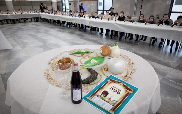 Young students in Beitar Illit simulate the Passover Seder on March 20, 2023 (Nati Shohat/Flash90)