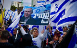 Rally in support of the government's planned judicial overhaul, in Tel Aviv on March 30, 2023. The Netanyahu banner reads: 'Many politicians; one leader.' (Avshalom Sassoni/Flash90)