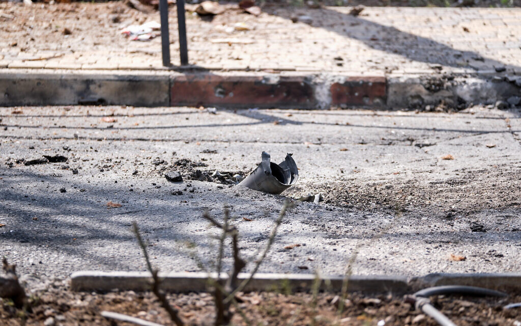 Israeli security at the scene where a rocket fired from Lebanon hit the northern Israeli town of Shlomi, April 6, 2023. (Fadi Amun/Flash90)