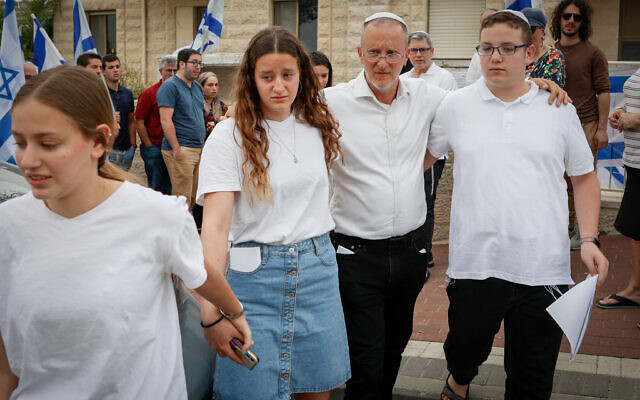 The family of Maia and Rina Dee outside their home in Efrat ahead of the two sisters' funeral on April 9, 2023. (Gershon Elinson/FLASH90)