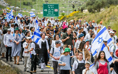 Israelis march to the Evyatar outpost, near the West Bank city of Nablus, during the Passover holiday, on April 10, 2023. (Sraya Diamant/Flash90)