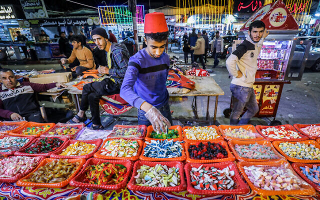 Palestinians shop at the market in Rafah, in the southern Gaza Strip on April 17, 2023, ahead of the upcoming holiday of Eid al-Fitr. (Abed Rahim Khatib/Flash90)