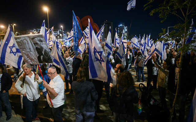 Demonstrators protesting the government's planned judicial overhaul, protest outside the official state ceremony celebrating Israel's 75th Independence Day, at Mt. Herzl, Jerusalem. April 25, 2023. (Arie Leib Abrams/Flash90)