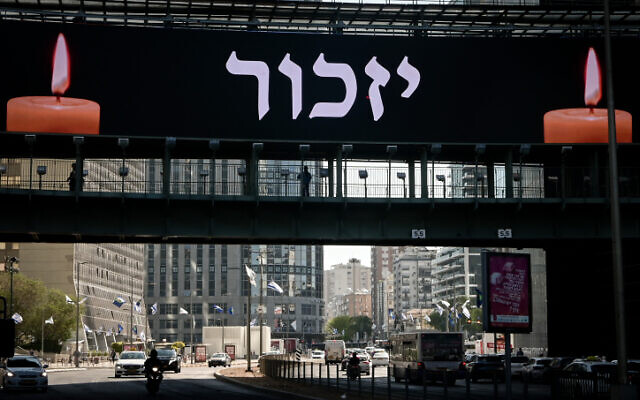 A large banner reading 'Remember' hangs in Tel Aviv on Memorial Day, April 25, 2023. (Avshalom Sassoni/Flash90)