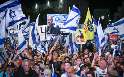 Right-wing Israelis attend a rally in support of the government's planned judicial overhaul, outside the Knesset in Jerusalem, on April 27, 2023. (Arie Leib Abrams/Flash90)