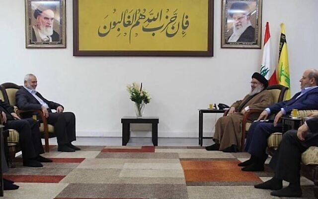 Hezbollah chief Hassan Nasrallah (back right) meets with Hamas leader Ismail Haniyeh (back left) and a delegation from the terror group in Beirut, Lebanon, April 9, 2023. (Twitter photo screenshot; used in accordance with Clause 27a of the Copyright Law)