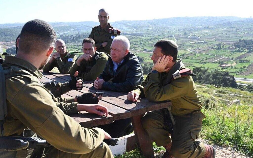 Defense Minister Yoav Gallant (second from right), during a briefing in the West Bank on April 2, 2023. (Ariel Hermoni/ Defense Ministry)