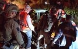 Rescue workers at the scene of a car crash near Moshav Amatzia in southern Israel, April 12, 2023. (United Hatzalah)