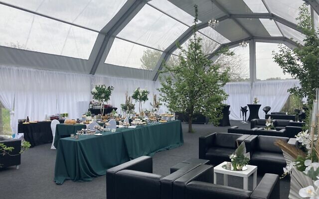 A VIP dining tent for major donors at the annual pilgrimage to the gravesite of 'Wonder Rabbi' Yeshaya Steiner in Bodrogkeresztur, Hungary, April 24, 2023. (Yaakov Schwartz/ Times of Israel)