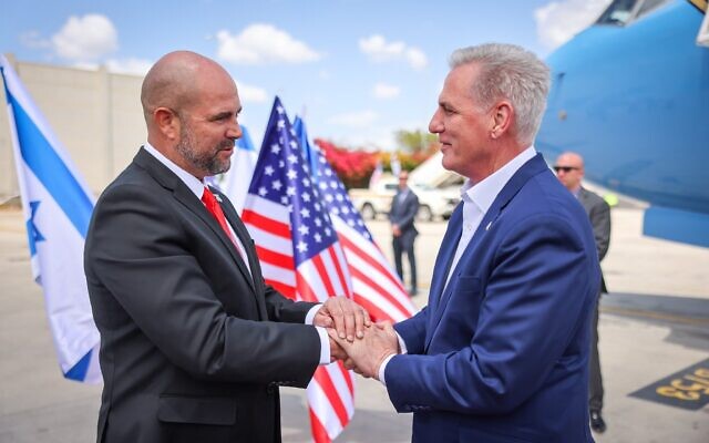 US House of Representatives Speaker Kevin McCarthy (right) arrives in Israel and is greeted by Knesset Speaker Amir Ohana, April 30, 2023. (Noam Moshkovich/ Knesset Press Office)