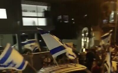 Screen capture from video of a pro-government demonstration outside the home of former chief justice Aharon Barak in Tel Aviv, April 19, 2023. (Twitter. Used in accordance with Clause 27a of the Copyright Law)