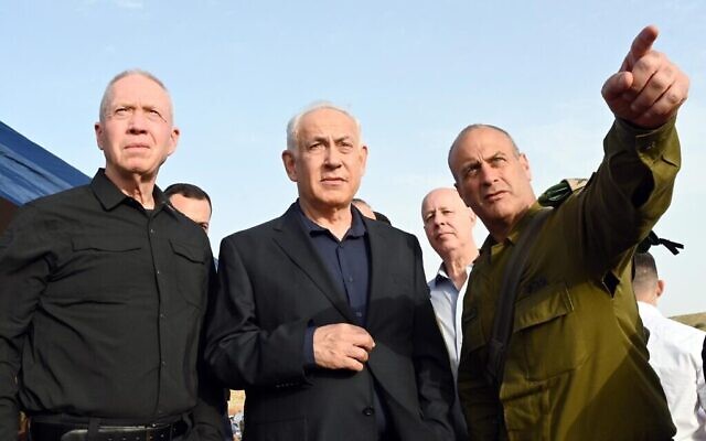 Defense Minister Yoav Gallant (left) and Prime Minister Benjamin Netanyahu, with OC Central Command Yehuda Fox, at the scene of a terror attack in the Jordan Valley on April 7, 2023. (Haim Zach/GPO)