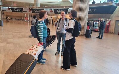 Angling to discuss the country's ongoing judicial shakeup, Israeli activists greet arriving passengers, Ben Gurion International Airport, April 21, 2023 (Courtesy Ben Gurion Airport Ask Me About Democracy Team)