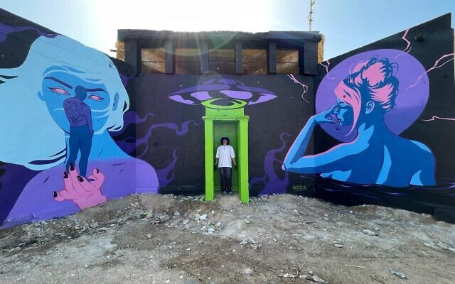 Artist James Haunt painted a mural on abandoned Jordanian army barracks on the banks of the Dead Sea as part of Artists 4 Israel for Earth Day, April 22, 2023 (Courtesy Artists 4 Israel)